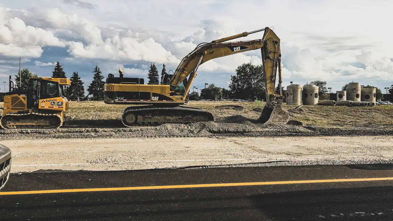 An excavator and a bulldozer at work on a construction site