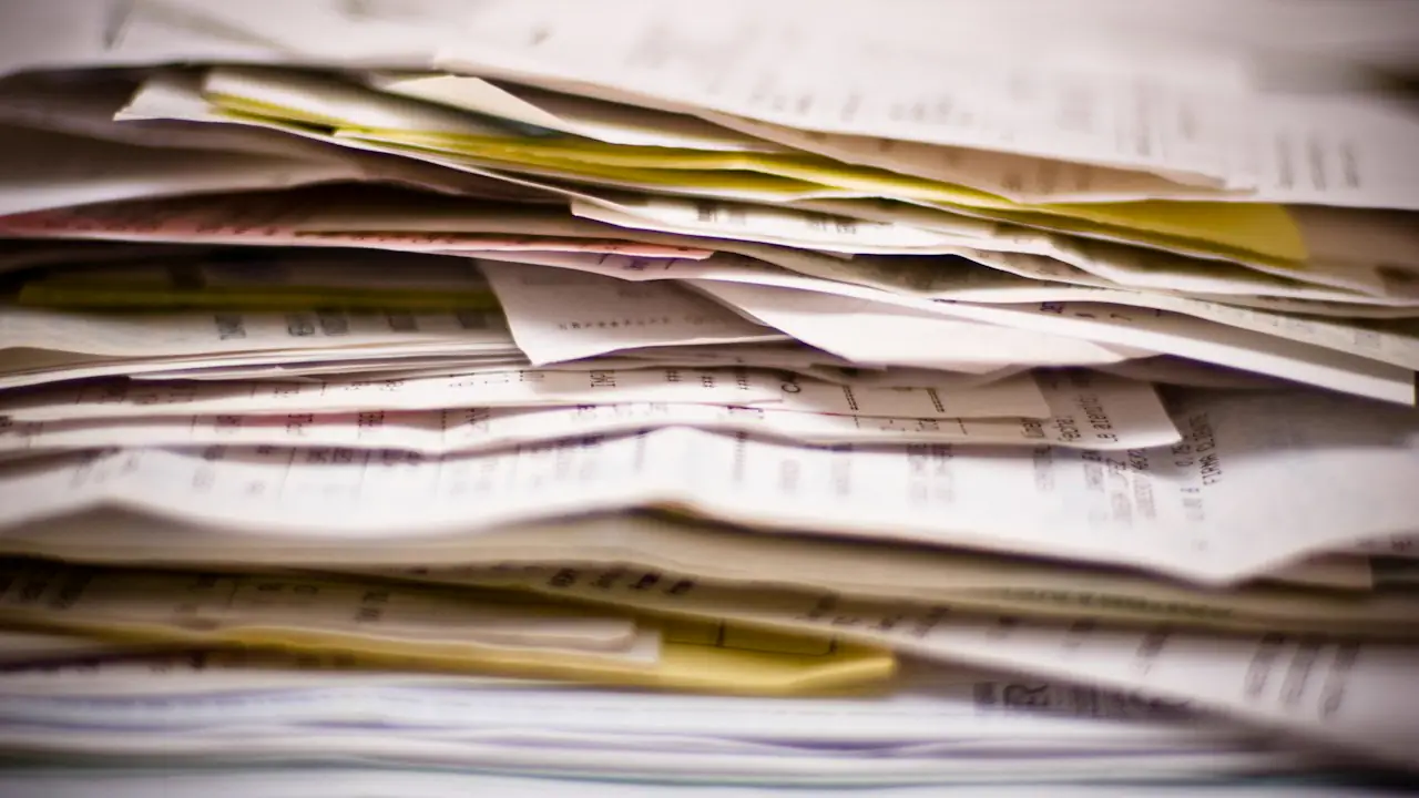 A pile of papers and receipts waiting to be sorted