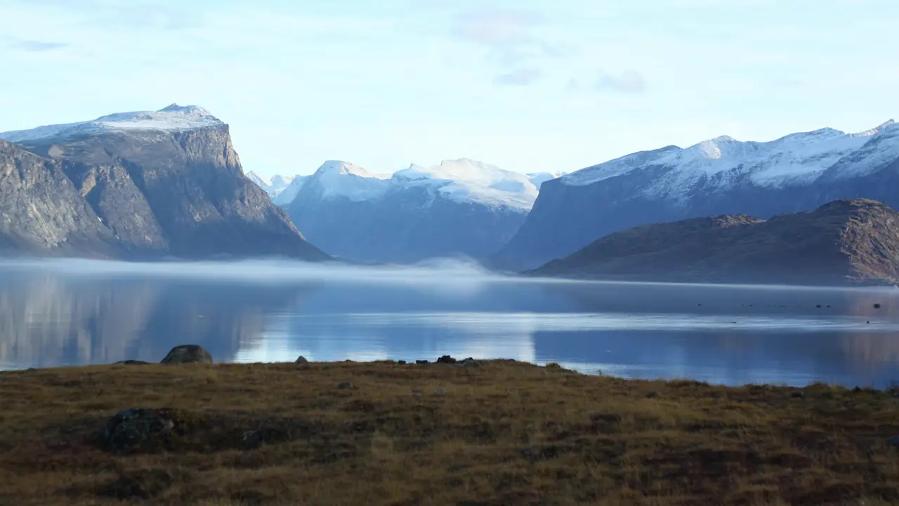 Mountains above the calm water of Pangnirtung Fiord on Baffin Island, Nunavut
