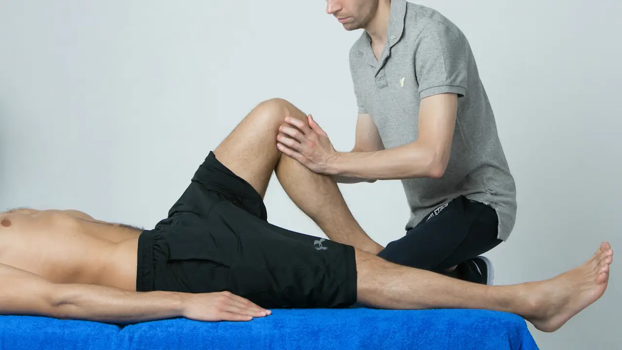 A physiotherapist treating a patient's knee