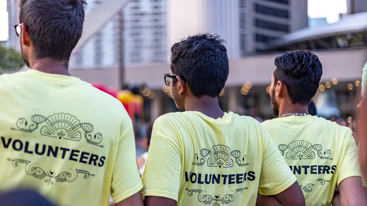 Volunteers in matching yellow shirts at a community event