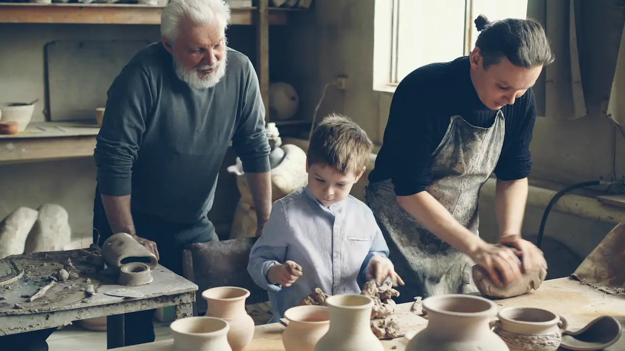 Three generations working together in a pottery studio