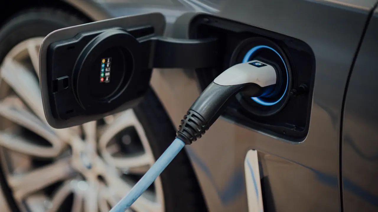 An electric car plugged into a charger