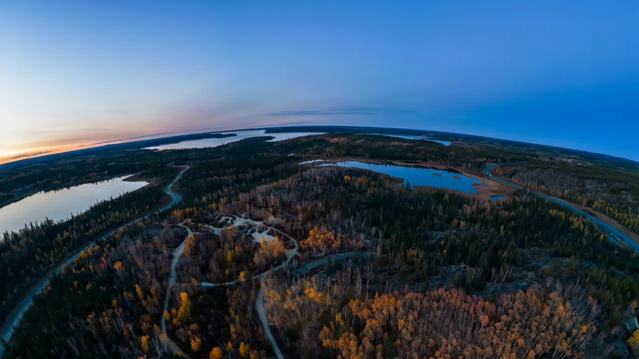 Autumn gold and green across the lakes and forest of the North Slave region around Yellowknife